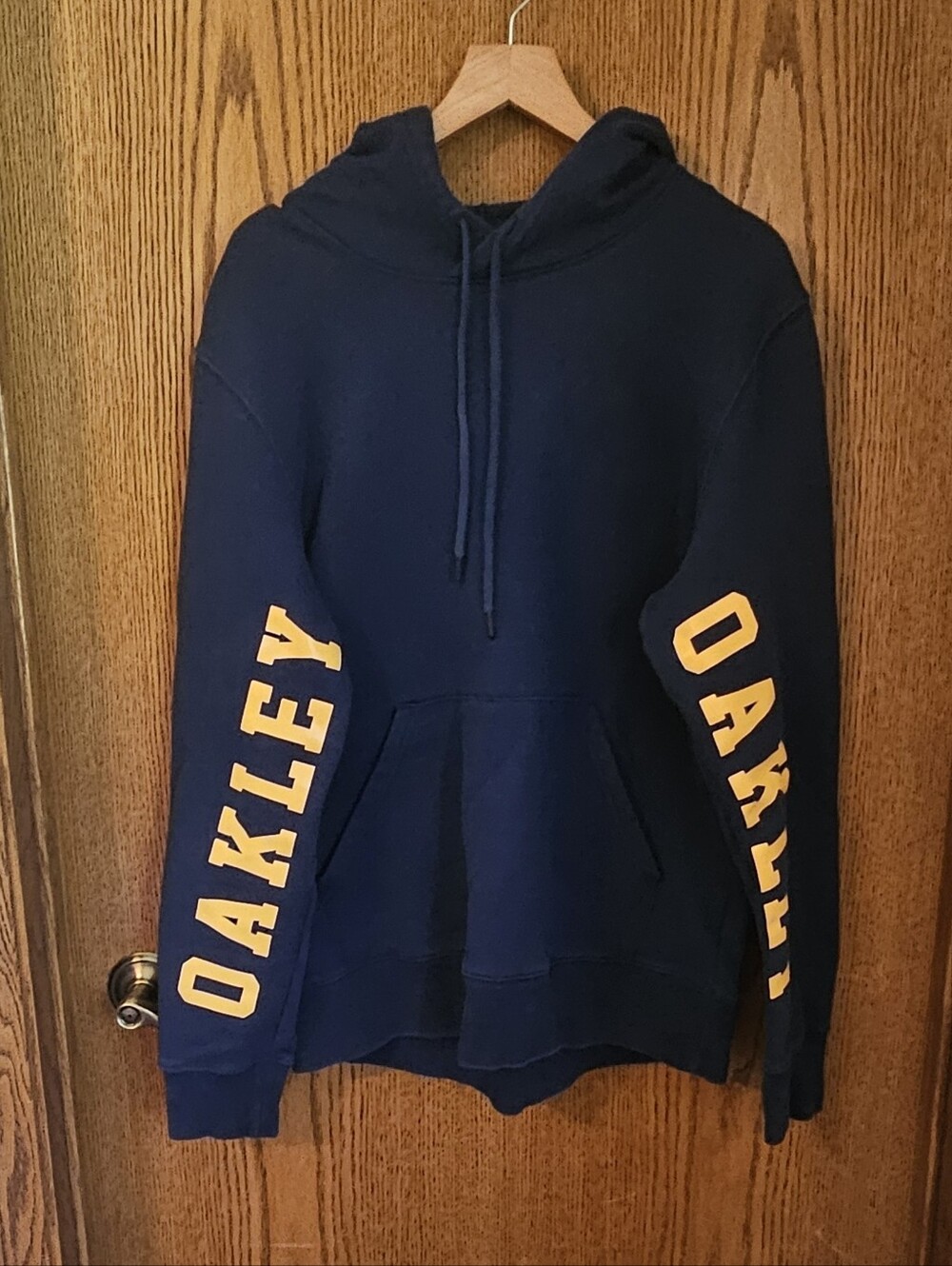 Men's Oakley Navy Hoodie with Yellow Sleeve Logos